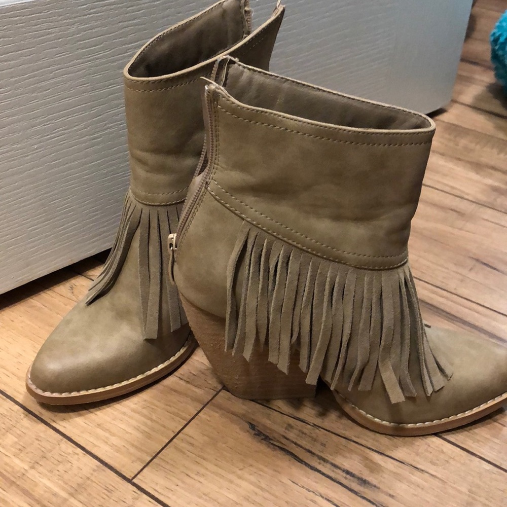Very volatile fringe booties